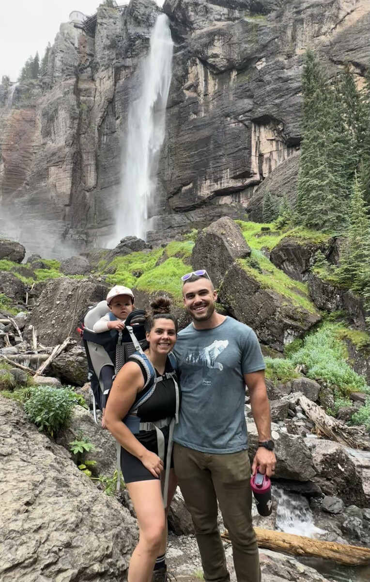 Family hiking at a waterfall