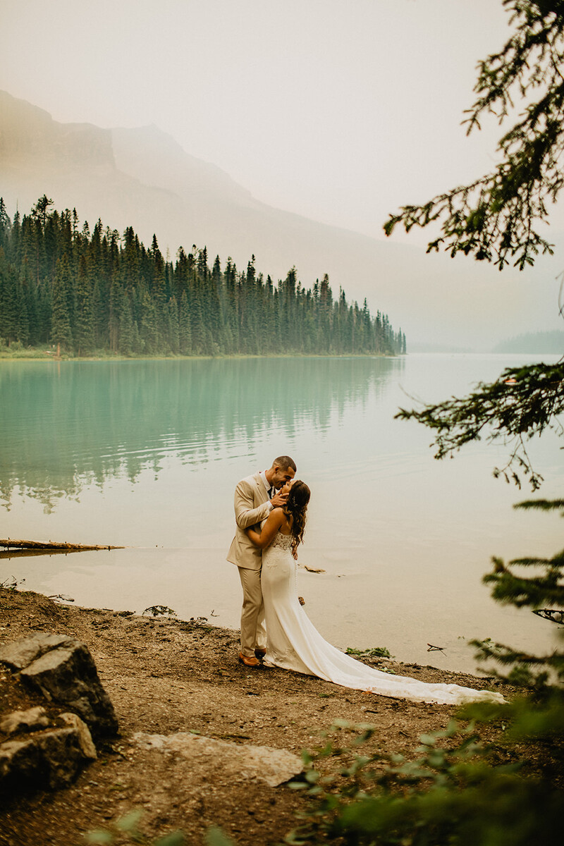 Logan and Sarah wedding photo by a mountain lake